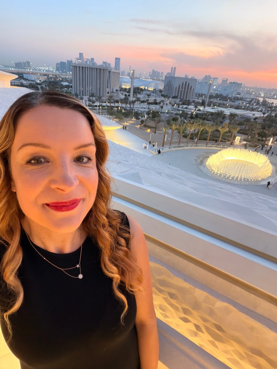 Corina Goetz overlooking the Abu Dhabi skyline from the Zayed National Museum at sunset